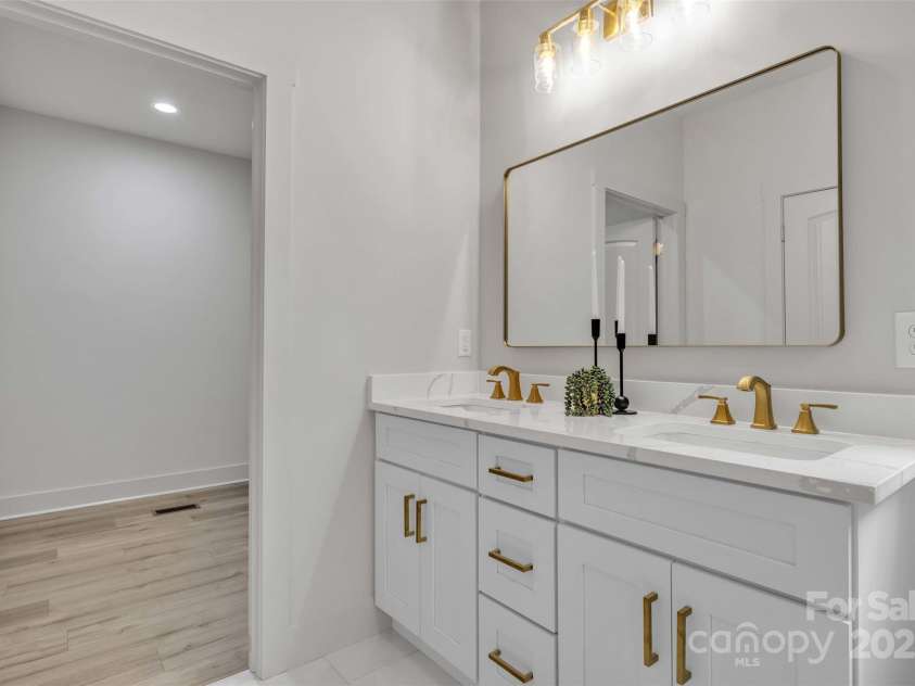 63 Cornerstone Drive, Taylorsville, NC 28681.  MLS# CAR4265503, YatesRealty ID 16787. Double Vanity with gold hardware