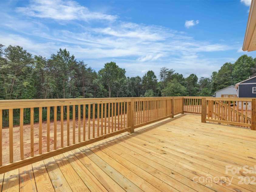63 Cornerstone Drive, Taylorsville, NC 28681.  MLS# CAR4265503, YatesRealty ID 16787. Spacious back deck