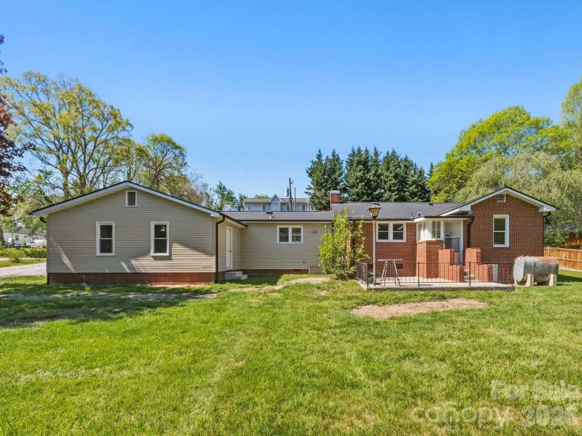 318 Resort Street, Hendersonville, NC 28792.  MLS# CAR4373822, YatesRealty ID 16792. Back with large yard!