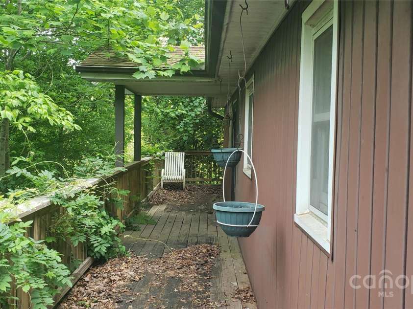31 Samuel Lane, Candler, NC 28715.  MLS# CAR4257442, YatesRealty ID 16797. Deck and front view