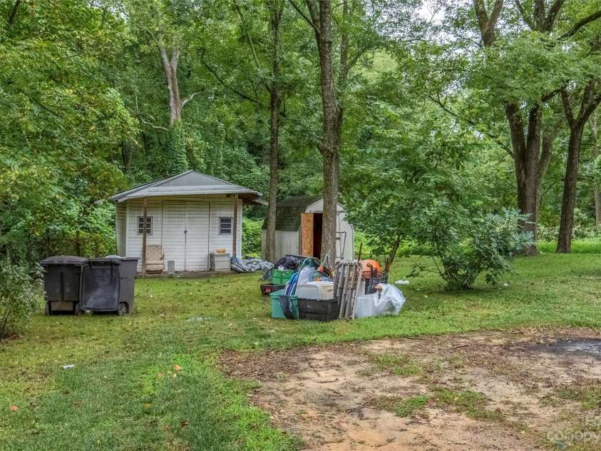 440 Oakland Avenue, Statesville, NC 28677.  MLS# CAR4080981, YatesRealty ID 168. Sheds & Large backyard(debris has been removed)