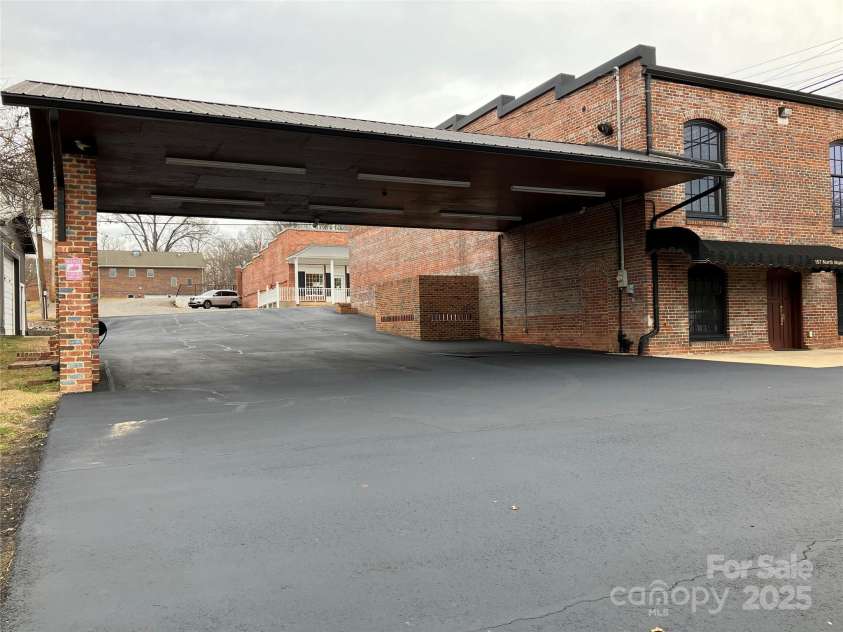 157 Main Street, Bostic, NC 28018.  MLS# CAR4329921, YatesRealty ID 1680. Carport (as viewed from rear of building)