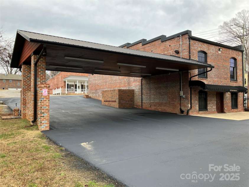 157 Main Street, Bostic, NC 28018.  MLS# CAR4329921, YatesRealty ID 1680. Side view with Carport