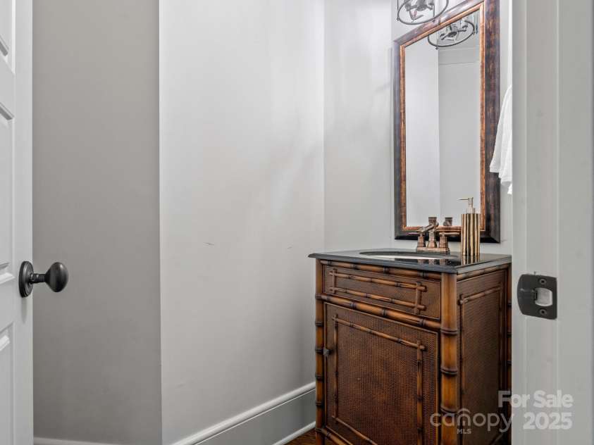 7906 Skye Lochs Drive, Waxhaw, NC 28173.  MLS# CAR4253185, YatesRealty ID 16803. Half bath in media room.