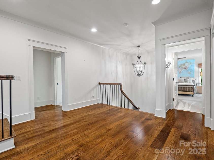 7906 Skye Lochs Drive, Waxhaw, NC 28173.  MLS# CAR4253185, YatesRealty ID 16803. Site stained hardwoods upstairs landing
