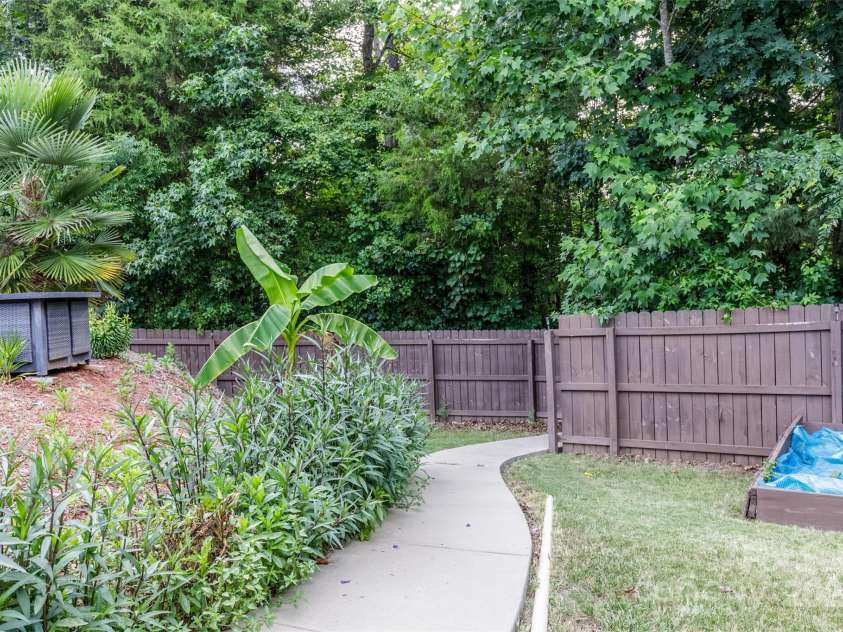 127 Tranquil Court, Locust, NC 28097.  MLS# CAR4152427, YatesRealty ID 1681. Path to nature trail and pond