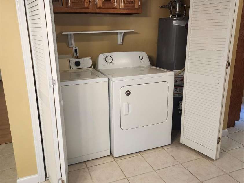 4409 Homestead Road, Rock Hill, SC 29732.  MLS# CAR4255629, YatesRealty ID 16826. Laundry closet in kitchen with washer/dryer/Gas HW heater