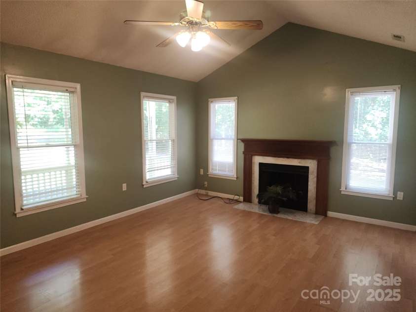 4409 Homestead Road, Rock Hill, SC 29732.  MLS# CAR4255629, YatesRealty ID 16826. LR with vaulted ceiling, lots of windows, fireplace