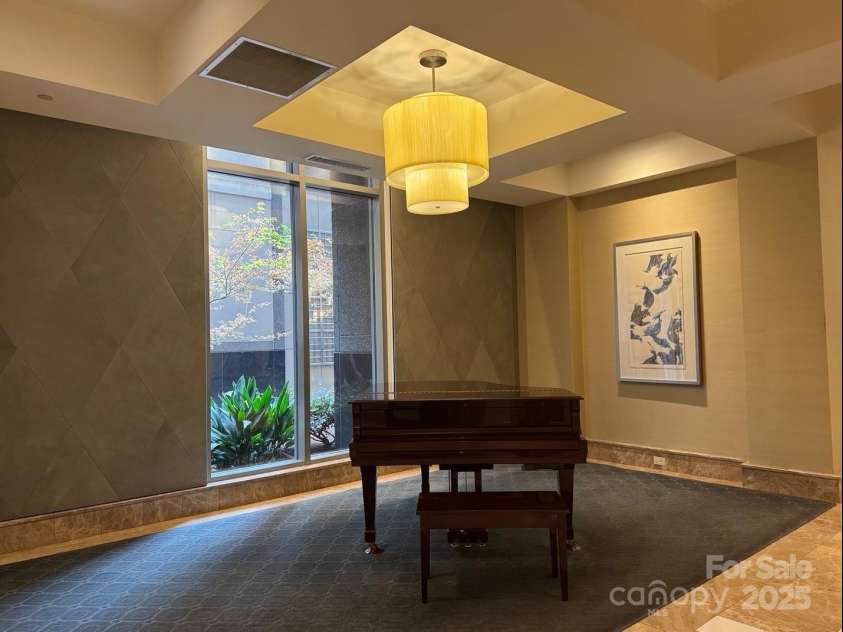 230 Tryon Street, Charlotte, NC 28202.  MLS# CAR4321048, YatesRealty ID 1683. Lobby going back towards the elevator