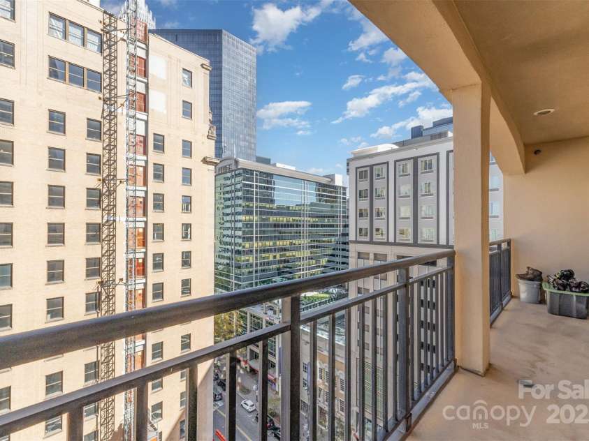 230 Tryon Street, Charlotte, NC 28202.  MLS# CAR4321048, YatesRealty ID 1683. View from balcony by the Living Room