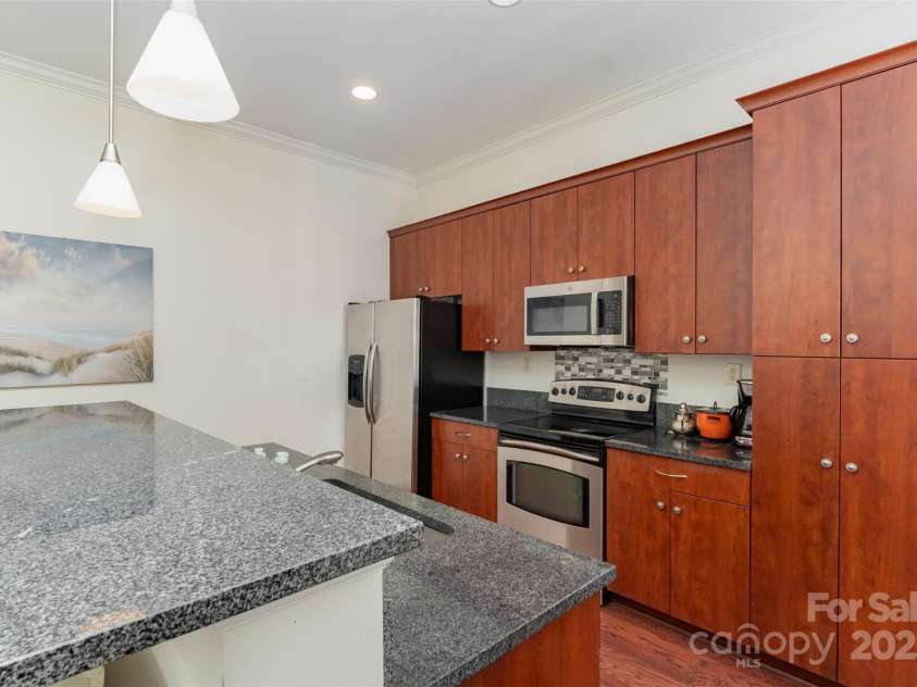 230 Tryon Street, Charlotte, NC 28202.  MLS# CAR4321048, YatesRealty ID 1683. View of Kitchen with back towards the windows