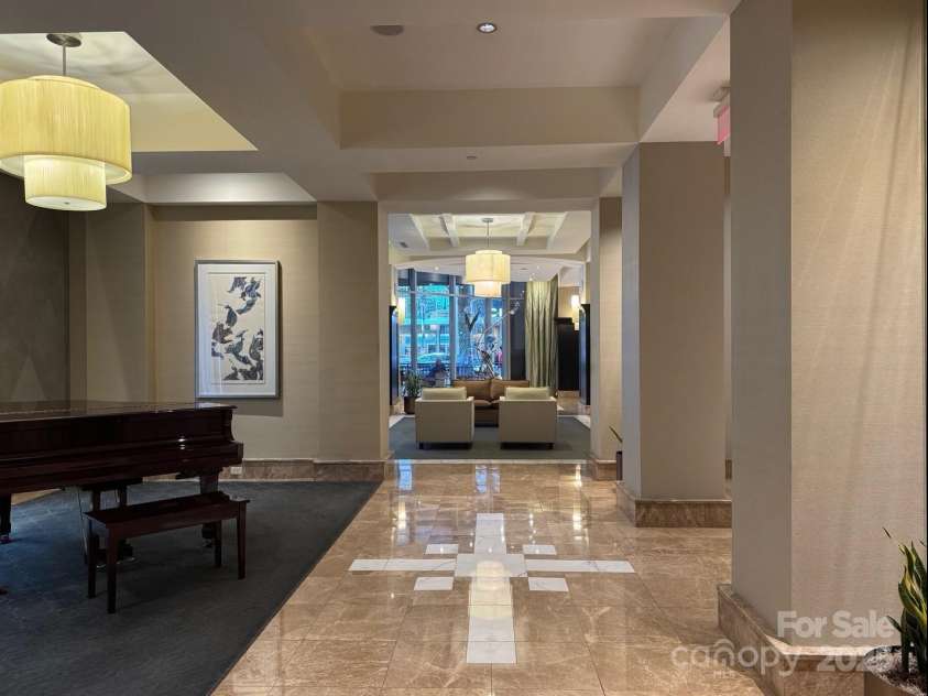 230 Tryon Street, Charlotte, NC 28202.  MLS# CAR4321048, YatesRealty ID 1683. View of Lobby from back by the elevator