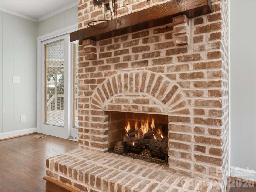 814 Twin Oaks Road, Davidson, NC 28036.  MLS# CAR4360259, YatesRealty ID 16830. Beautiful brick hearth and gas fireplace