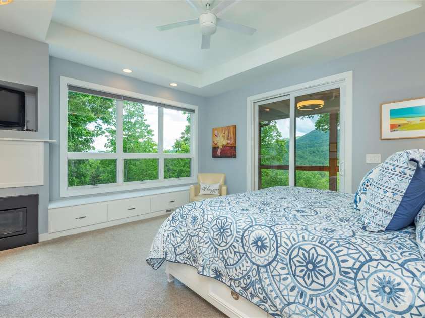201 Ruffed Grouse Lane, Waynesville, NC 28786.  MLS# CAR4257615, YatesRealty ID 16833. Primary bedroom with natural light and views