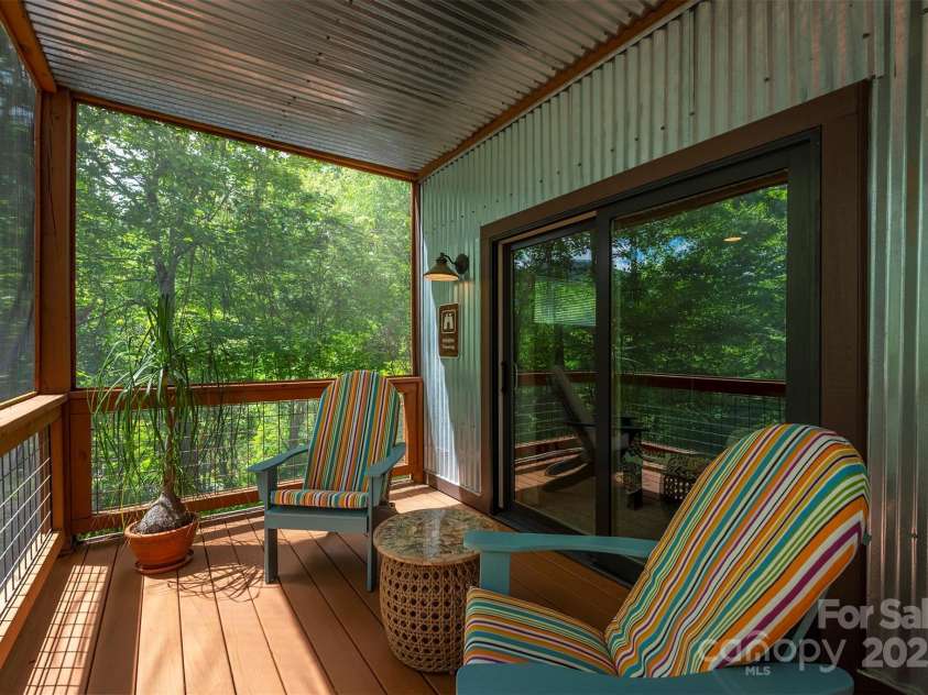 201 Ruffed Grouse Lane, Waynesville, NC 28786.  MLS# CAR4257615, YatesRealty ID 16833. Screened deck off guest bedroom