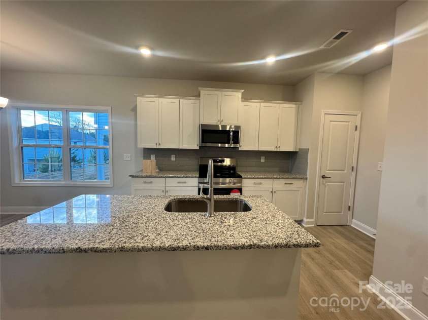 713 Inwood Hill Drive, Gastonia, NC 28056.  MLS# CAR4234423, YatesRealty ID 16839. Spacious kitchen island