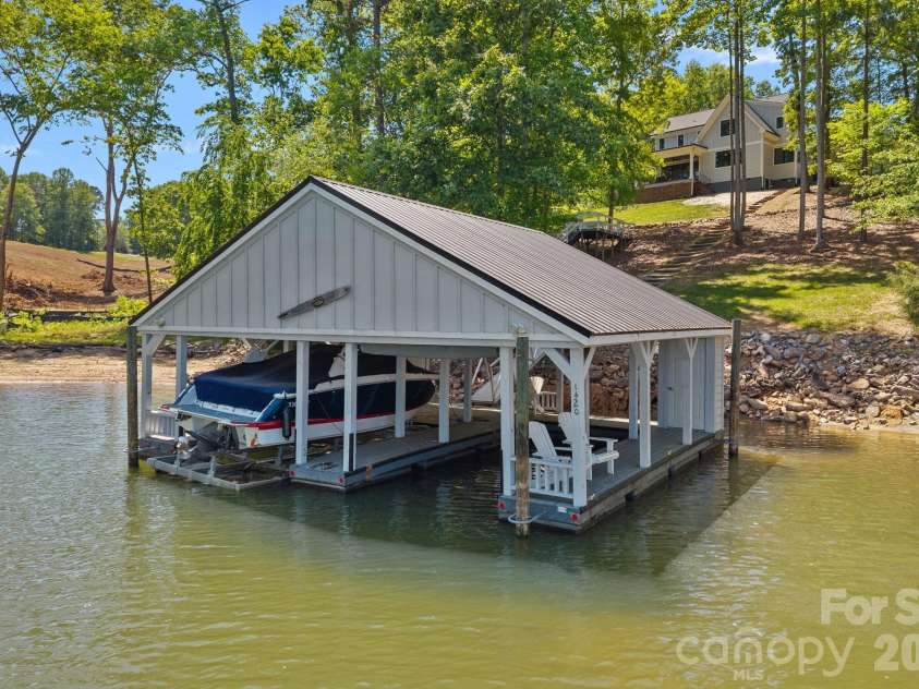 1420 Roundstone Road, Sherrills Ford, NC 28673.  MLS# CAR4369339, YatesRealty ID 16847. Your own covered boathouse with two slips. 