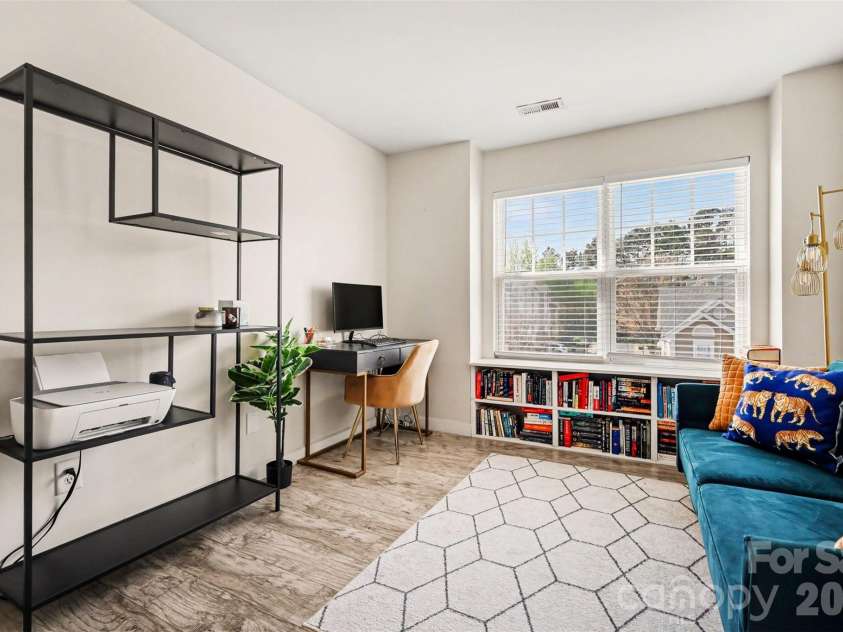 2729 Avalon Loop Road, Charlotte, NC 28269.  MLS# CAR4366095, YatesRealty ID 16859. Bright secondary bedroom featuring large front-facing windows that fill the space with natural light.