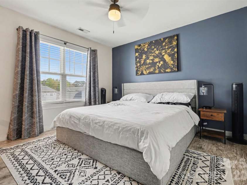2729 Avalon Loop Road, Charlotte, NC 28269.  MLS# CAR4366095, YatesRealty ID 16859. Spacious primary bedroom featuring updated LVP flooring throughout the upper level and a generous walk-in closet for added storage and convenience.