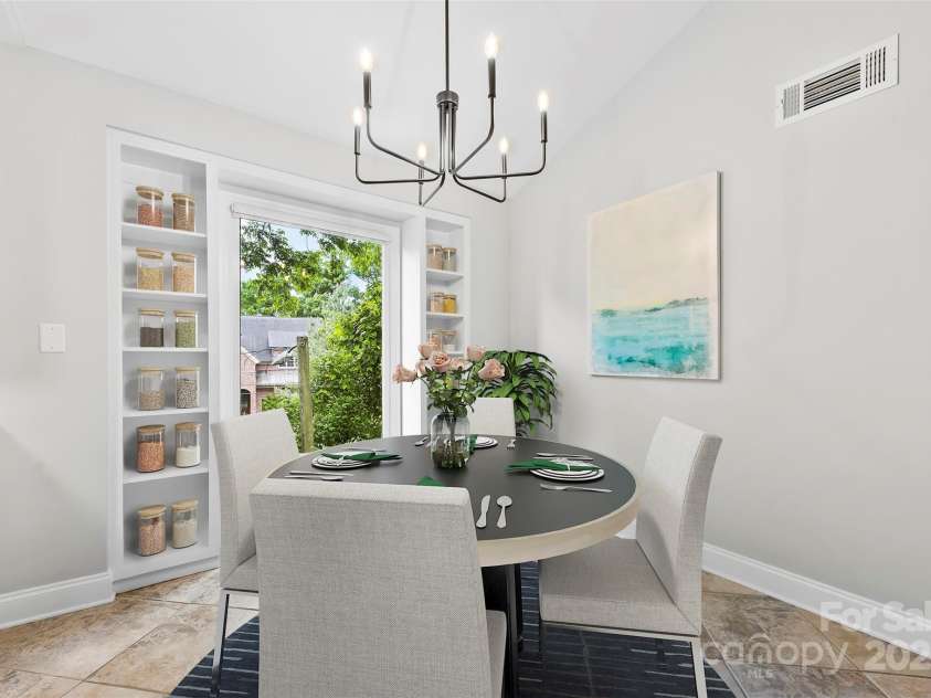 430 Queens Road, Charlotte, NC 28207.  MLS# CAR4259102, YatesRealty ID 1686. Virtually staged Dining Room with built-in storage and Vaulted Ceilings