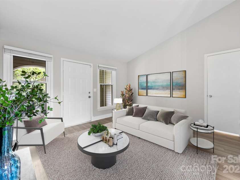 430 Queens Road, Charlotte, NC 28207.  MLS# CAR4259102, YatesRealty ID 1686. Virtually staged Living Room with plenty of windows and Vaulted Ceilings