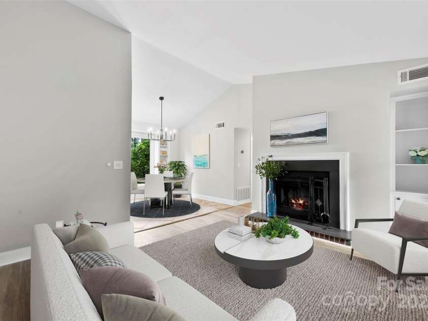 430 Queens Road, Charlotte, NC 28207.  MLS# CAR4259102, YatesRealty ID 1686. Virtually staged Living Room with the fireplace, vaulted ceilings and plenty of built-in storage