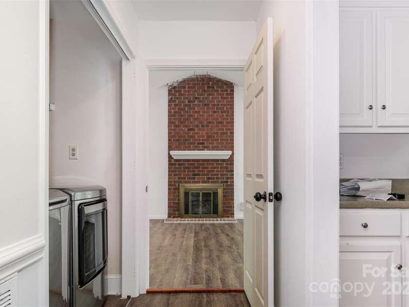 8429 Meadowcroft Court, Charlotte, NC 28215.  MLS# CAR4263498, YatesRealty ID 16860. Hallway to family room