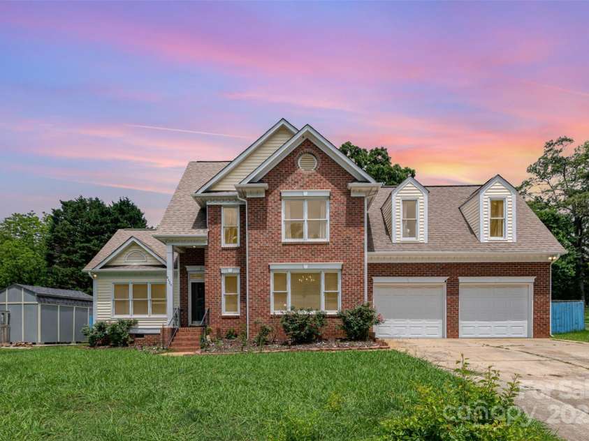 8429 Meadowcroft Court, Charlotte, NC 28215.  MLS# CAR4263498, YatesRealty ID 16860. Picture altered to show home at twilight.