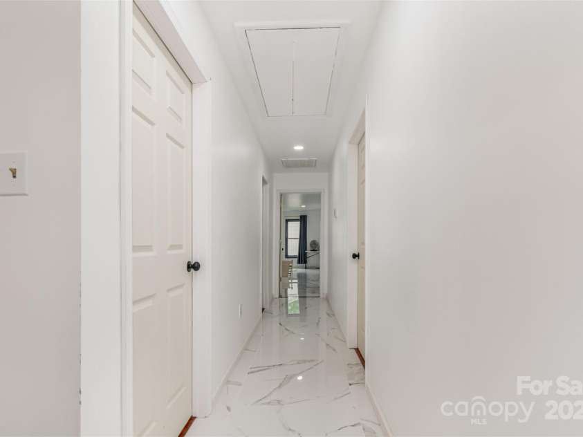 8429 Meadowcroft Court, Charlotte, NC 28215.  MLS# CAR4263498, YatesRealty ID 16860. Upper hallway to bonus/4th bedroom.