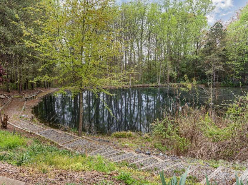 130 Hopedale Court, Mooresville, NC 28117.  MLS# CAR4245050, YatesRealty ID 16862. Neighborhood pond with walking path