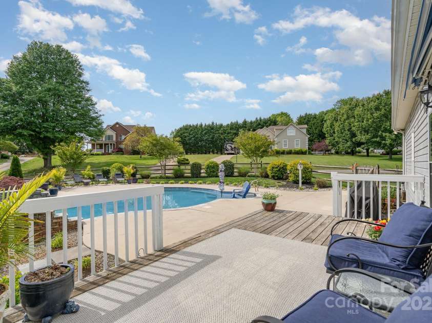 130 Hopedale Court, Mooresville, NC 28117.  MLS# CAR4245050, YatesRealty ID 16862. Step outside to a perfect spot to relax after a day on the lake or in your pool