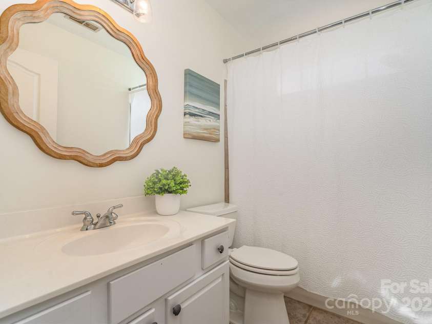 130 Hopedale Court, Mooresville, NC 28117.  MLS# CAR4245050, YatesRealty ID 16862. Upstairs Hall Bath with tiled shower/tub combo