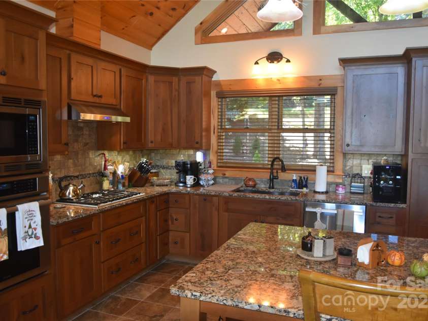 80 Grandview Loop, Nebo, NC 28761.  MLS# CAR4317495, YatesRealty ID 16868. A cook's kitchen with plenty of room, granite counter tops.