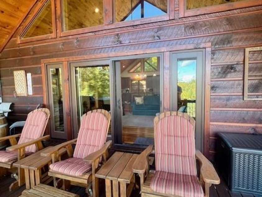 80 Grandview Loop, Nebo, NC 28761.  MLS# CAR4317495, YatesRealty ID 16868. Adirondack chairs for relaxing on the ample deck.