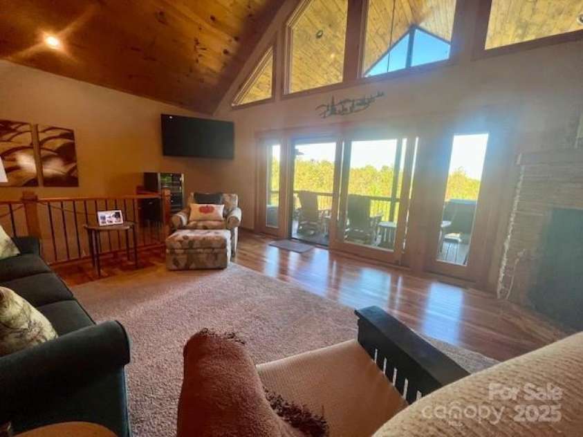 80 Grandview Loop, Nebo, NC 28761.  MLS# CAR4317495, YatesRealty ID 16868. Living room and views of the deck.