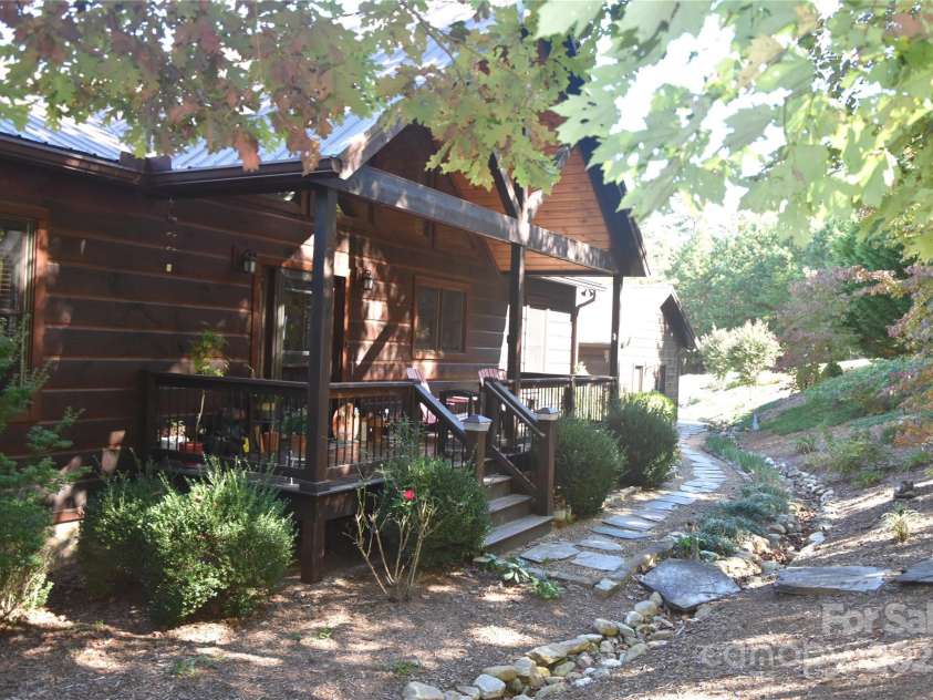 80 Grandview Loop, Nebo, NC 28761.  MLS# CAR4317495, YatesRealty ID 16868. Summer view of the front of home and shade trees.