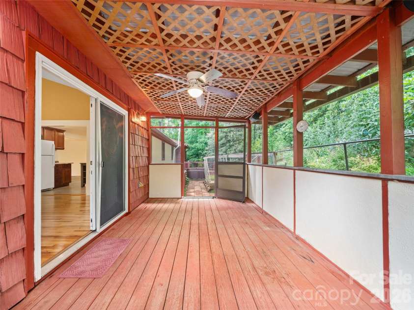 125 HEARTLAND Lane, Burnsville, NC 28714.  MLS# CAR4273356, YatesRealty ID 16873. Screened back porch, exit to back of house.