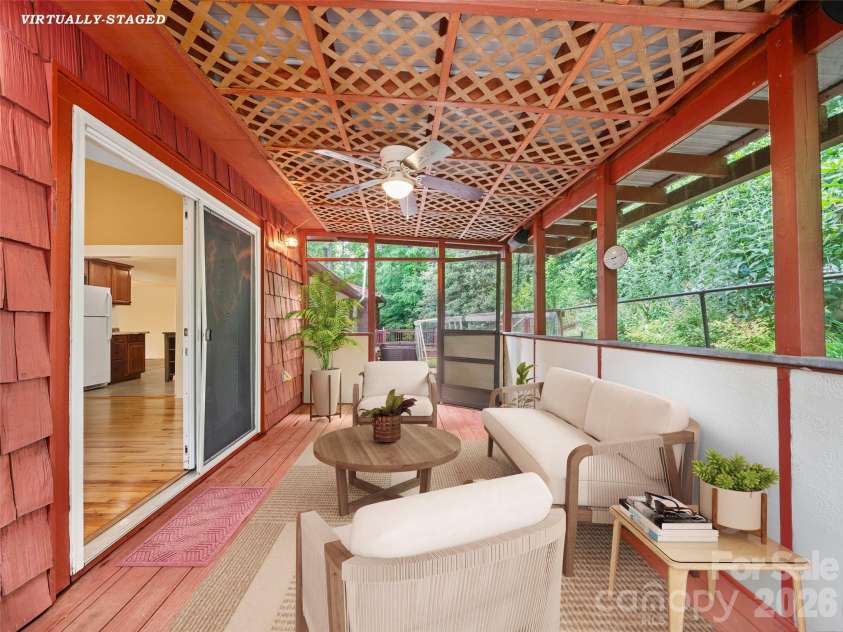 125 HEARTLAND Lane, Burnsville, NC 28714.  MLS# CAR4273356, YatesRealty ID 16873. Screened back porch, virtually staged