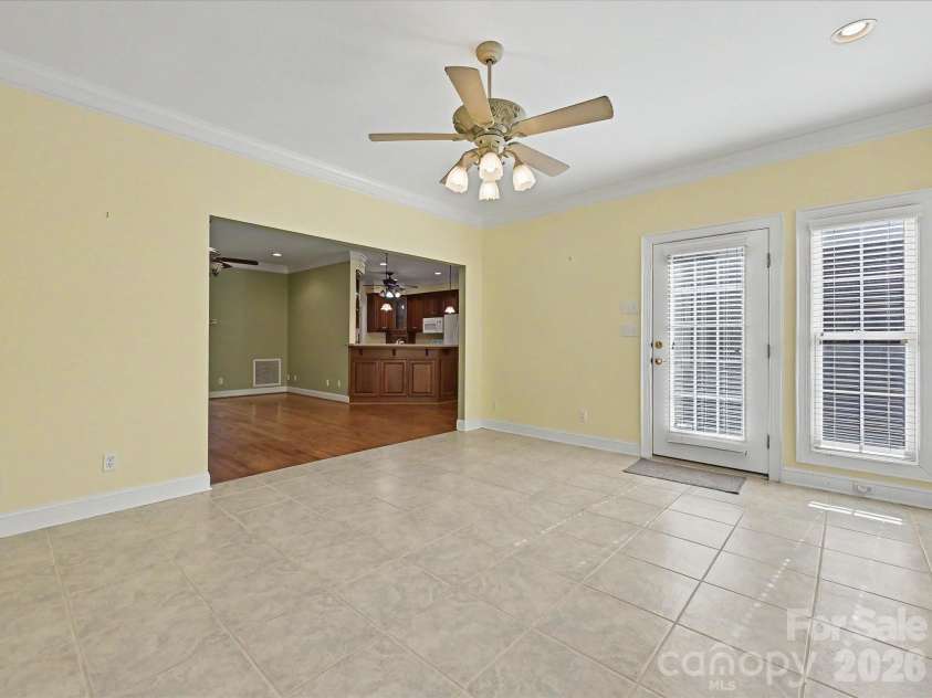 10896 Pioneer Mill Road, Concord, NC 28025.  MLS# CAR4369471, YatesRealty ID 16875. Sunroom with deck access
