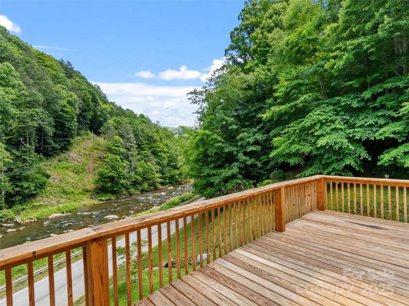 12982 US HWY 19W None, Burnsville, NC 28714.  MLS# CAR4234088, YatesRealty ID 16876. Deck looking over river.