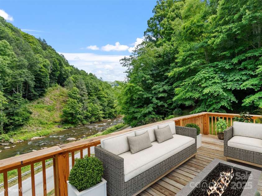 12982 US HWY 19W None, Burnsville, NC 28714.  MLS# CAR4234088, YatesRealty ID 16876. Virtually Staged, deck looking over river.