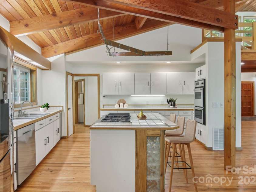 295 Dills Road, Bryson City, NC 28713.  MLS# CAR4280910, YatesRealty ID 16878. Kitchen with island and lots of storage space