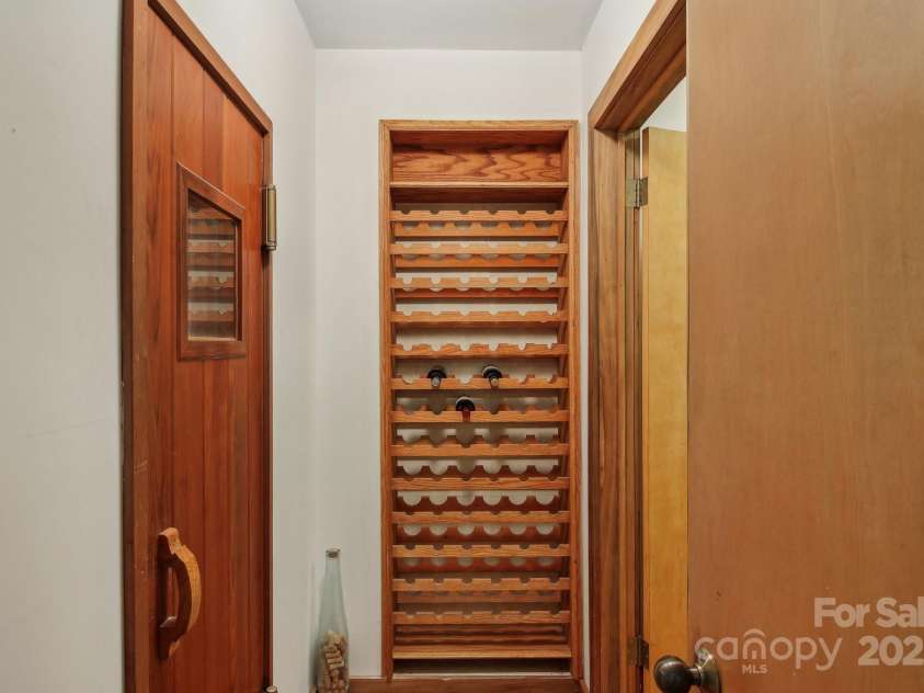 295 Dills Road, Bryson City, NC 28713.  MLS# CAR4280910, YatesRealty ID 16878. Lower Level with a Sauna and wine storage