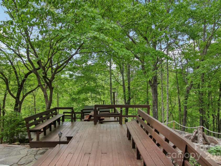 295 Dills Road, Bryson City, NC 28713.  MLS# CAR4280910, YatesRealty ID 16878. Many built-in seating areas.  Like a little resort.