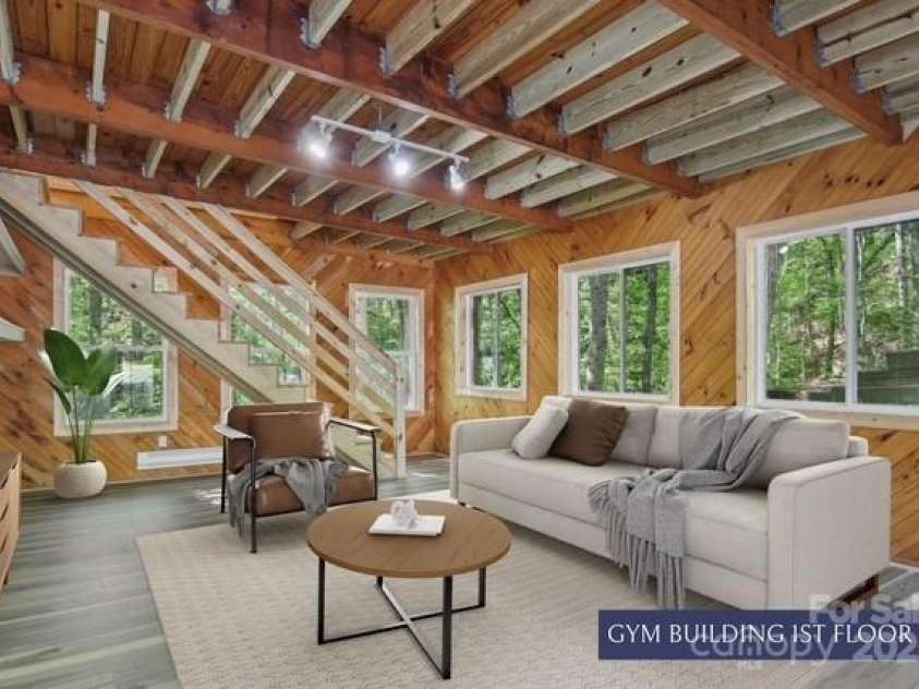 295 Dills Road, Bryson City, NC 28713.  MLS# CAR4280910, YatesRealty ID 16878. Virtually staged ground floor of gym/entertainment building