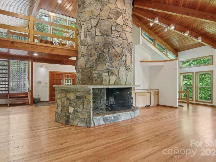 295 Dills Road, Bryson City, NC 28713.  MLS# CAR4280910, YatesRealty ID 16878. Wet bar to the right in the open living space