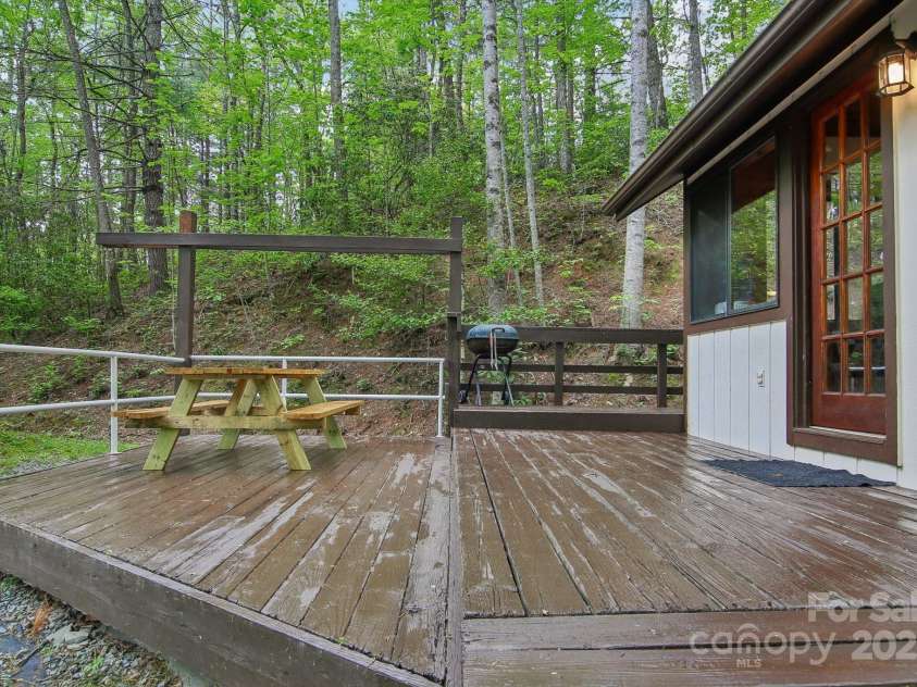 291 Dills Road, Bryson City, NC 28713.  MLS# CAR4261117, YatesRealty ID 16880. Back deck off the tiny home.