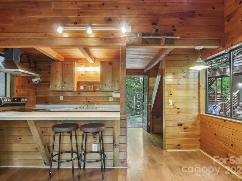 291 Dills Road, Bryson City, NC 28713.  MLS# CAR4261117, YatesRealty ID 16880. Kitchen with bar top seating