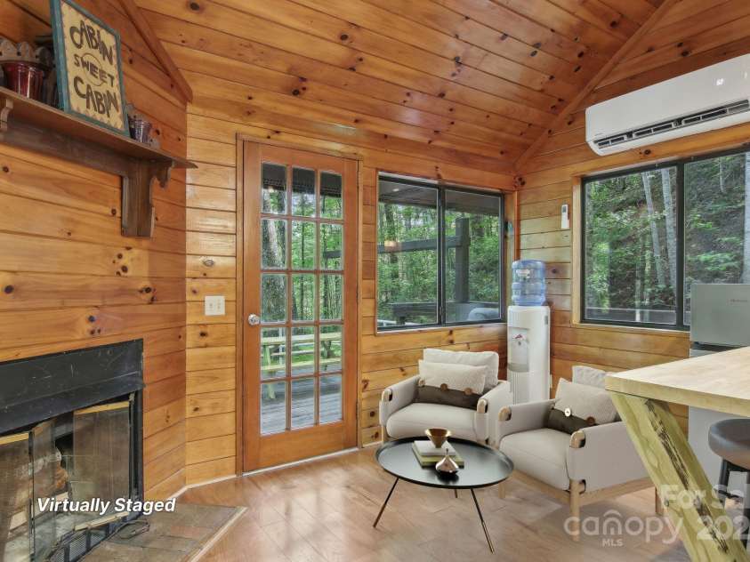 291 Dills Road, Bryson City, NC 28713.  MLS# CAR4261117, YatesRealty ID 16880. Virtually staged living area in the tiny home