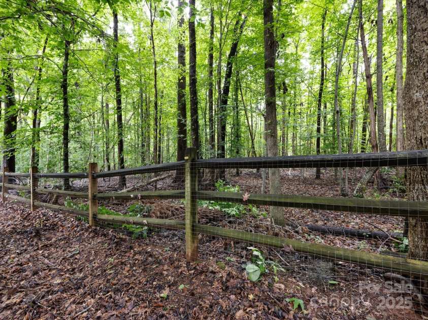 3347 Xandra Court, Indian Land, SC 29707.  MLS# CAR4266129, YatesRealty ID 16882. Backyard backs up to private wooded area.